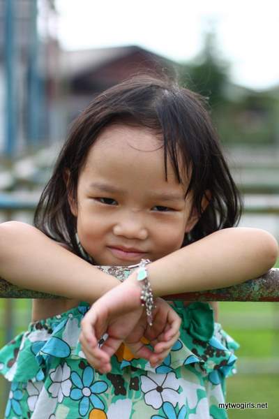 Zaria playing on the monkey bars